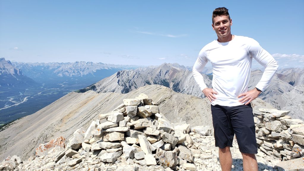 Stephen Wagner standing on Grotto Mountain Summit