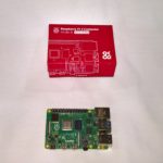Picture of Raspberry Pi 4 box and Raspberry Pi 4 board below box