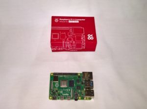 Picture of Raspberry Pi 4 box and Raspberry Pi 4 board below box